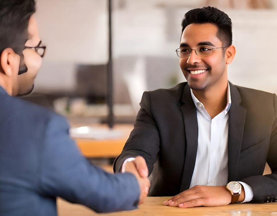 confident-businessman-shaking-ha-Picsart-AiImageEnhancer